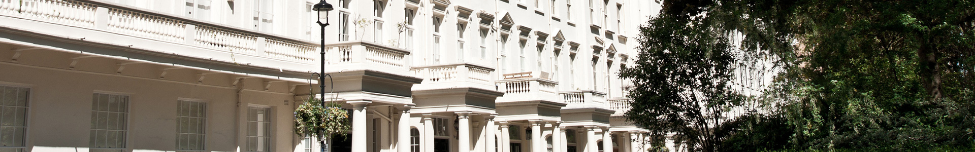 Row of white terraced houses in prime London property area