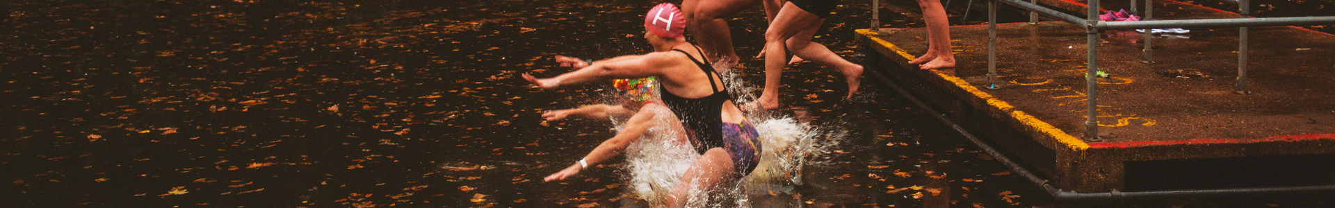 Ladies jumping into a lake