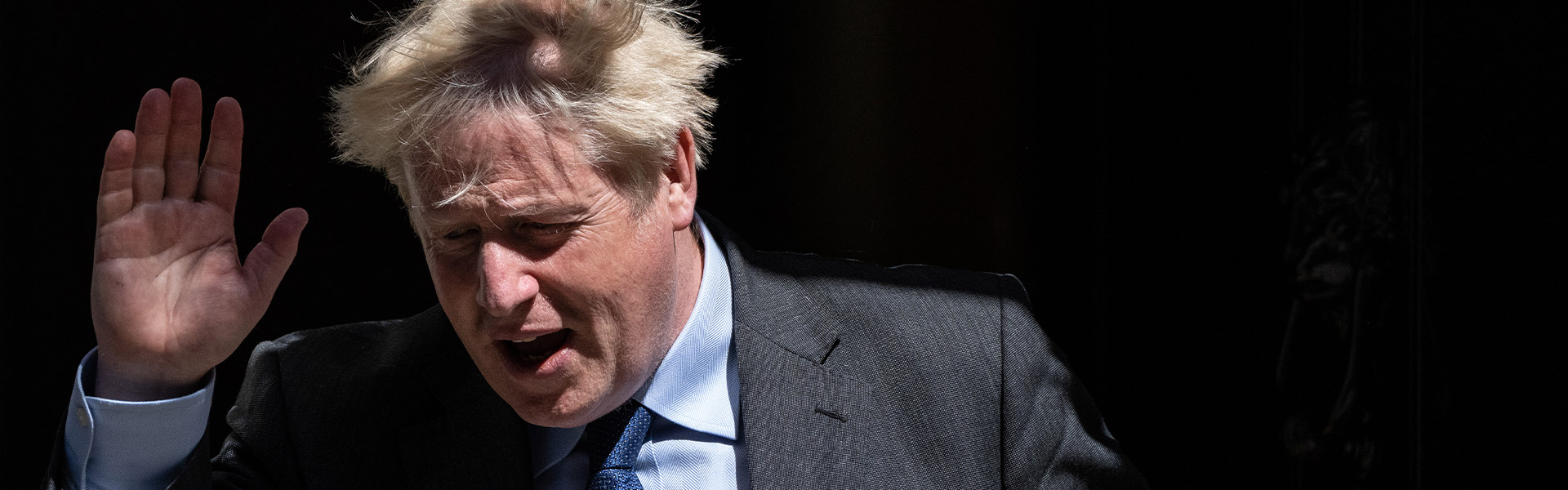 Boris Johnson waving while leaving Downing Street