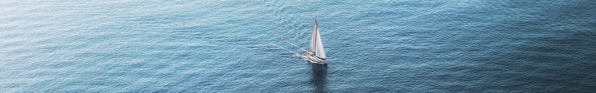 Sailing boat in the middle of the ocean