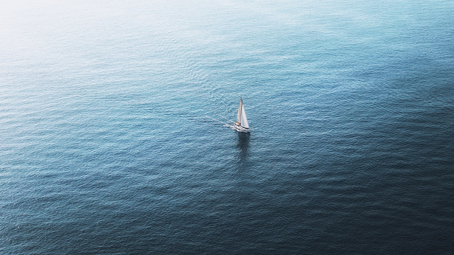 Sailing boat in the middle of the ocean