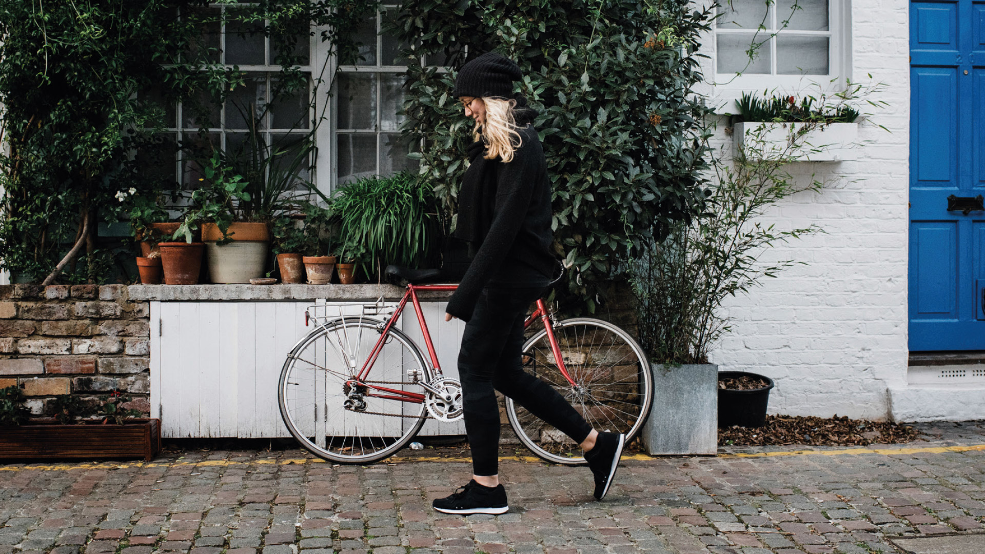 Female walking outside her house