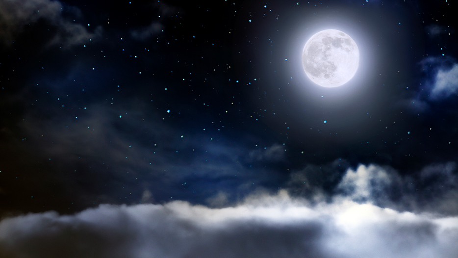 Full moon in the sky with clouds underneath