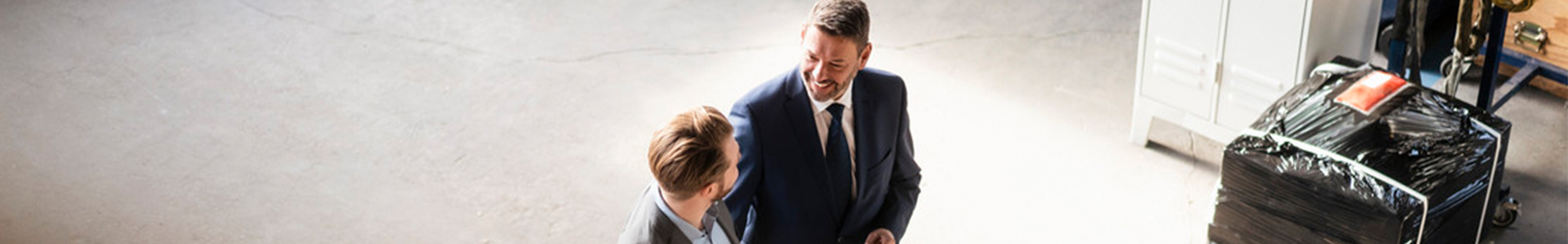 businessmen meeting on a factory floor