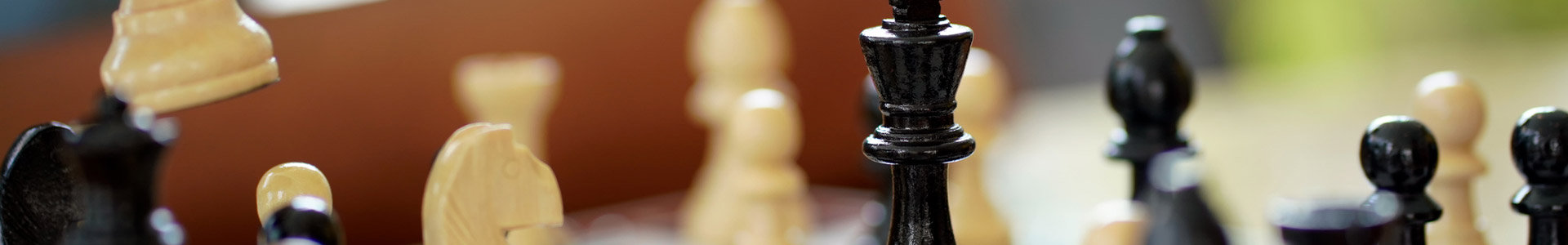 A chess piece is moved across a chess board