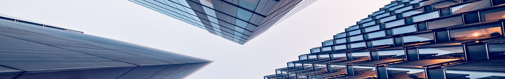 Looking upwards as three buildings close together