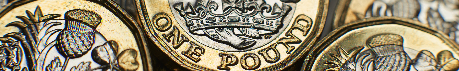 Stacks of pound coins layed flat
