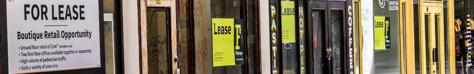 Row of empty shops available for lease
