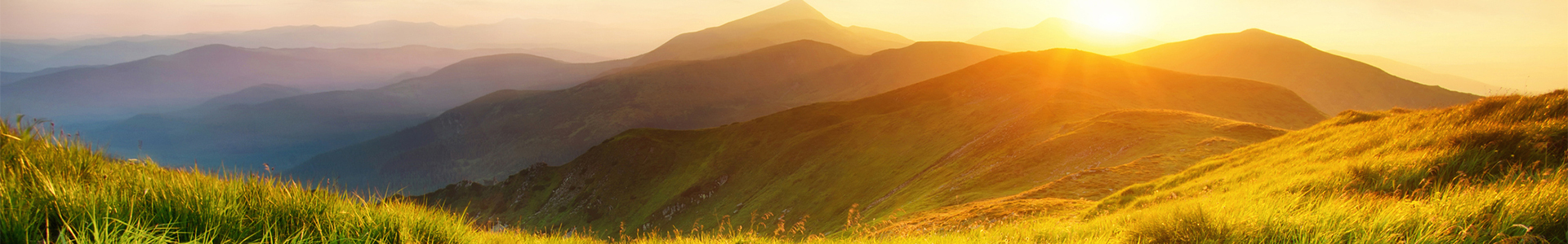 Sun rising over hills