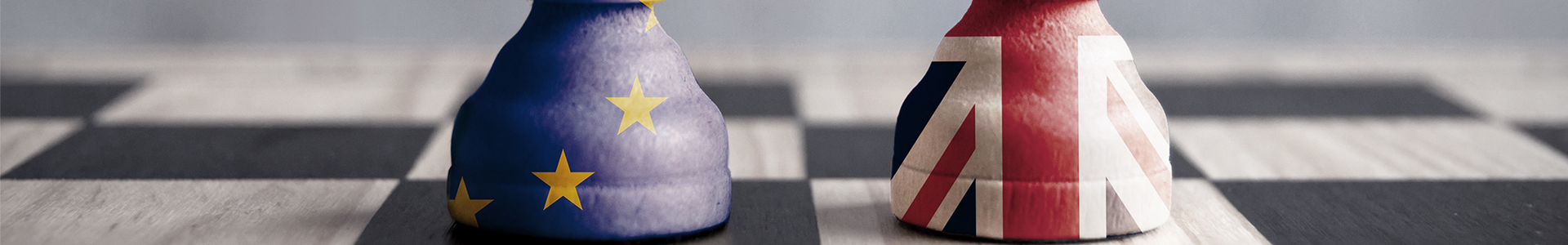 EU and UK chess pieces on chess board