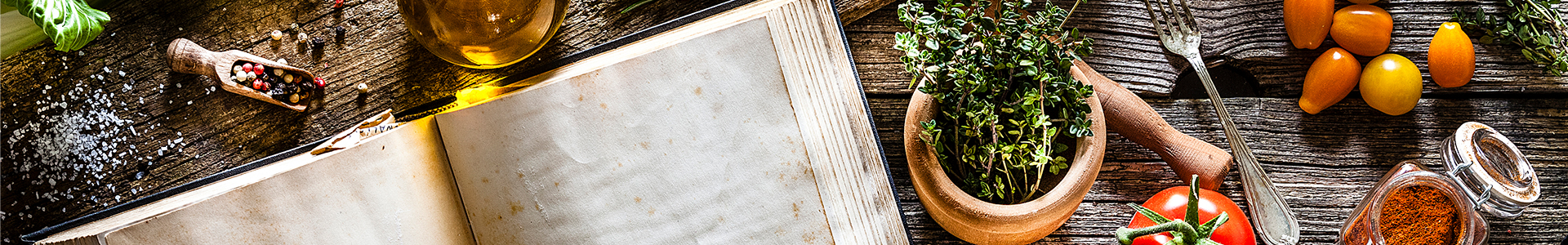 cook book with ingredients on a wooden table