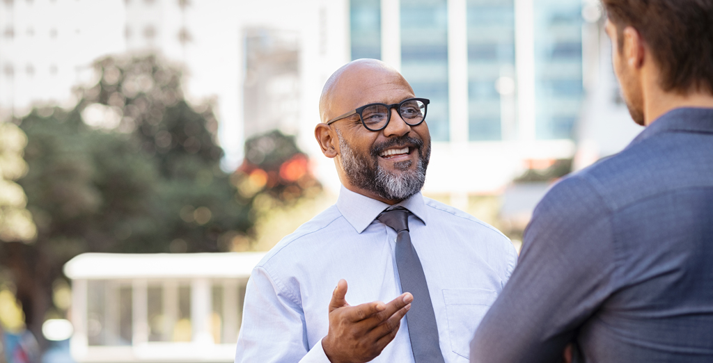 men discussing business savings