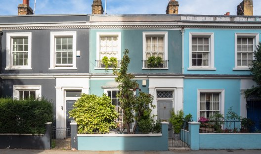 The fronts of different coloured British terrace houses