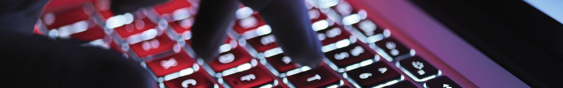 fingers typing on a keyboard