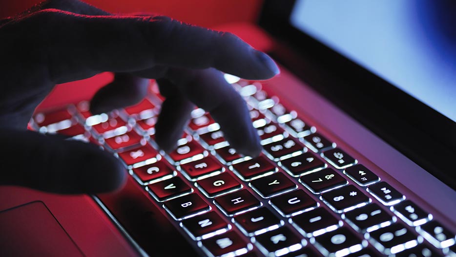 fingers typing on a keyboard