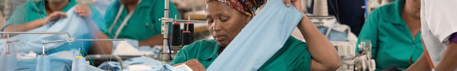Workers at Kinross Clothing manufacturers in Maitland, sew men's trousers on October 19, 2017, in Cape Town.
South Africa is fighting to revive its frayed clothing industry, once a crucial provider of jobs in a country suffering from high levels of unemployment, that has victim to a flood of cheap imports that has forced local factories to shutter and lay off workers. Once the economic lifeblood of many small regional towns, the abundance of cheaper products from China has led to the loss of nearly two-thirds of the sector's jobs over the past two decades. / AFP PHOTO / RODGER BOSCH        (Photo credit should read RODGER BOSCH/AFP/Getty Images)