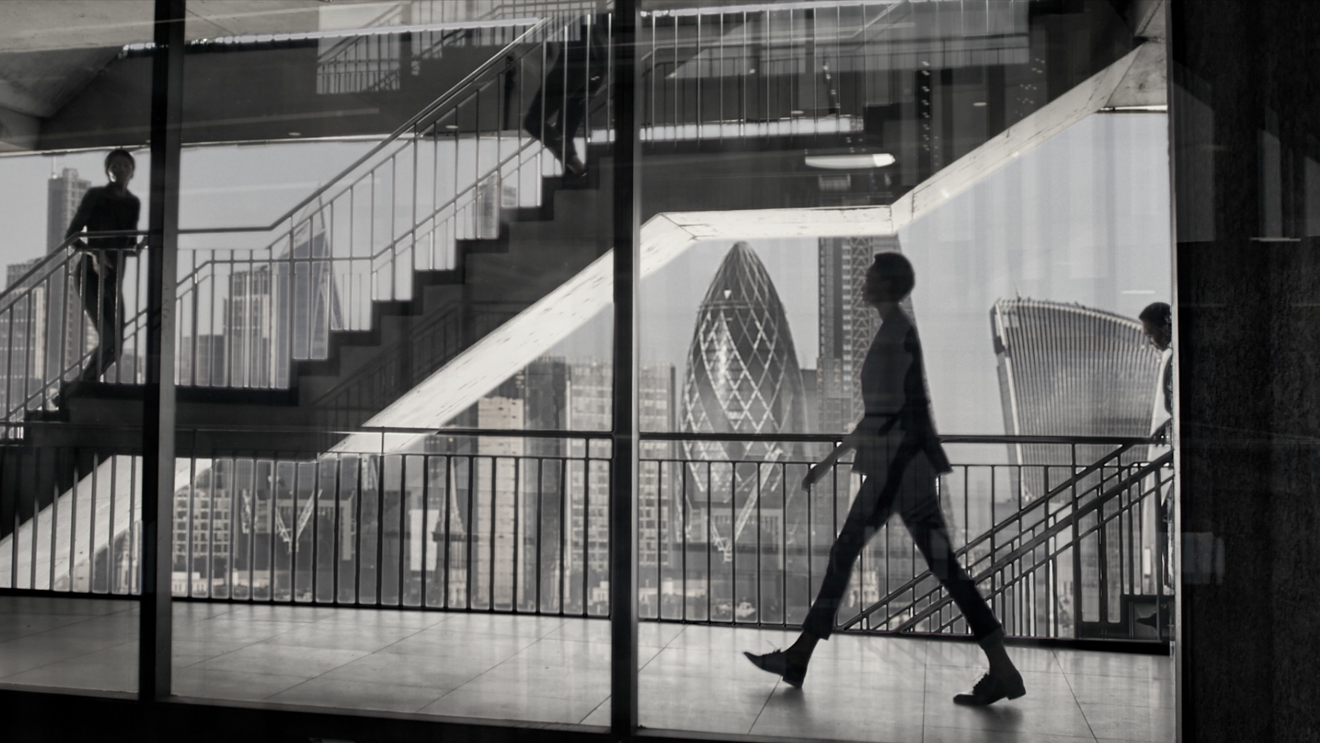 A lady walking through a London office building