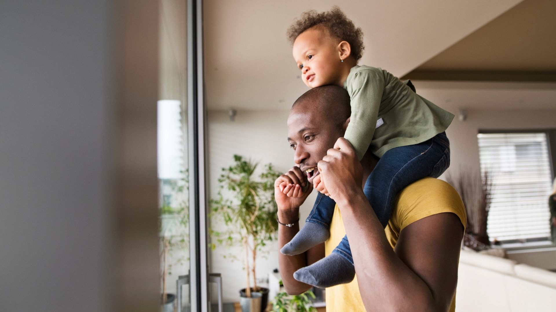 Man with small child on his shoulders