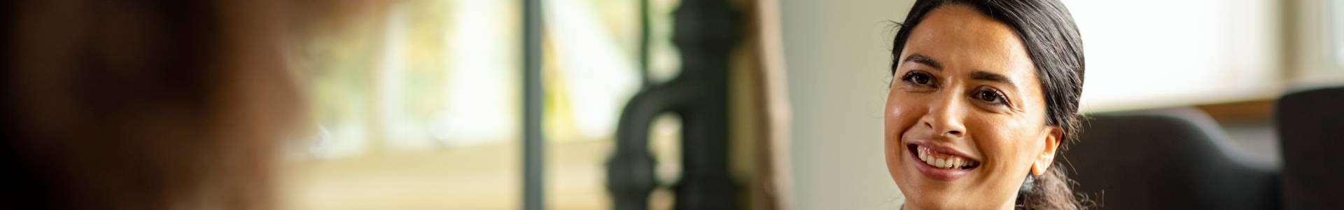 A charity worker speaks with a client