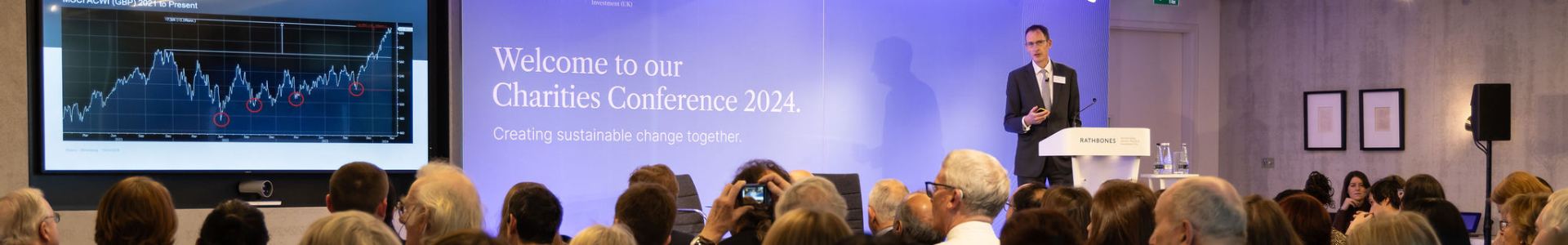 A packed room of attendees listen to John Wyn-Evans at the Charities Conference by Investec Wealth & Investment