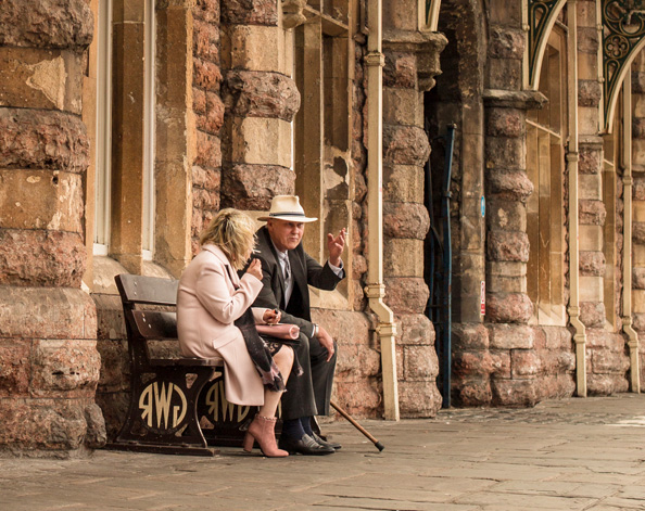 Couple waiting at train station