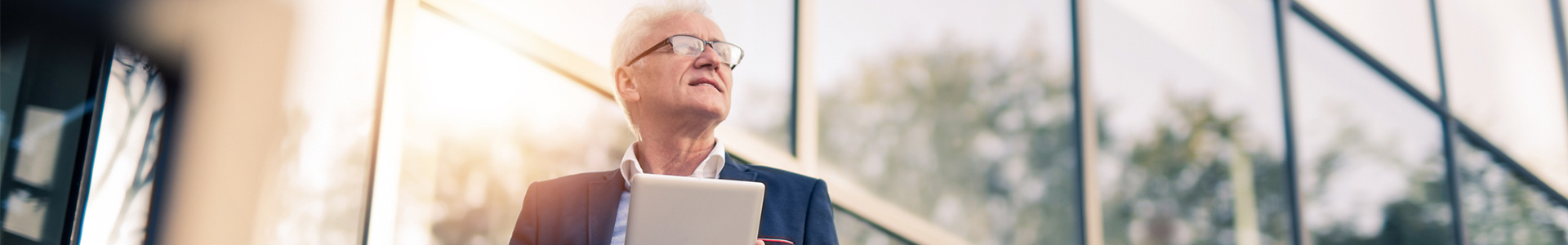businessman reading tablet outside the office