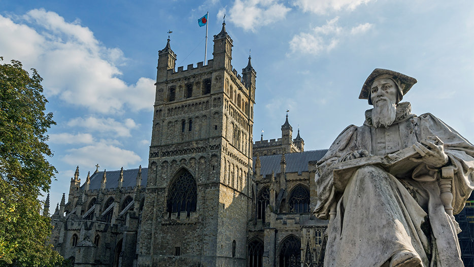 Exeter Catherdral, pictured behind the statue of Richard Hooker