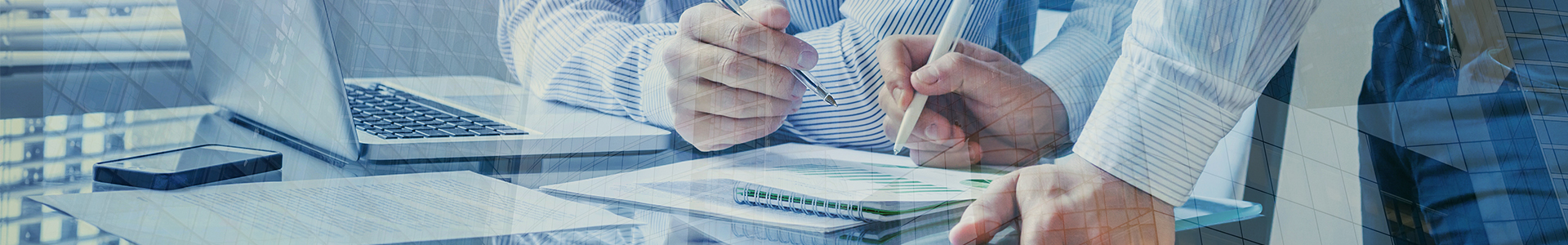 Businessmen working together over paperwork