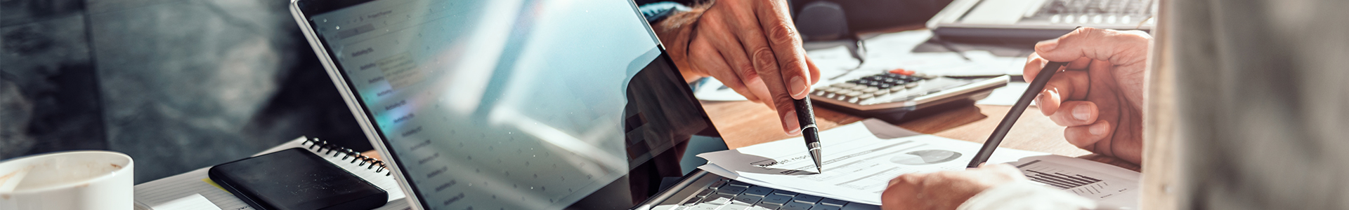 Planning business figures on latop and reports