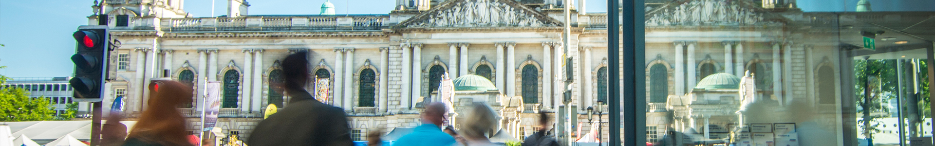 Shoppers walking by Belfast city hall