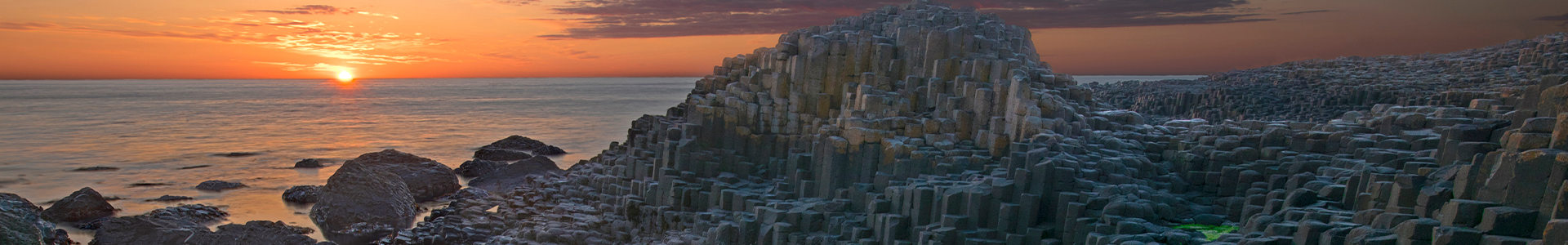 Sunset over basalt columns Giant's Causeway