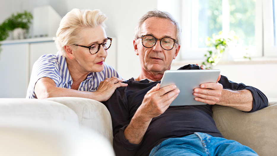 Older couple looking at an ipad