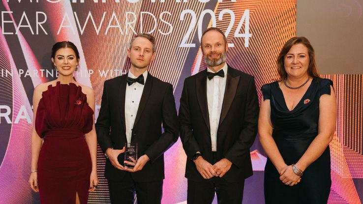 Domin collect their award for overall winners of the 2024 Innovator of the Year Award