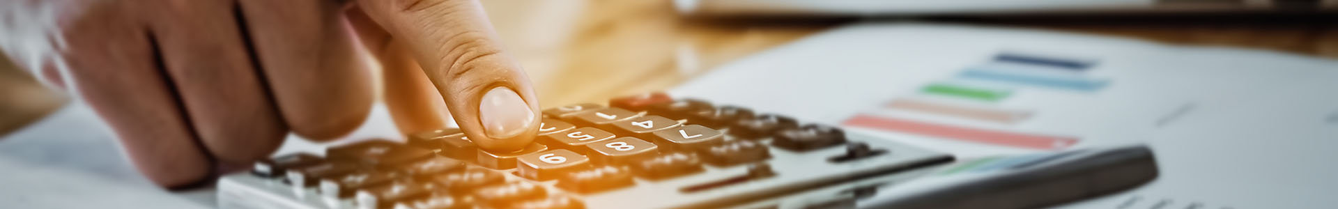 Man using a calculator