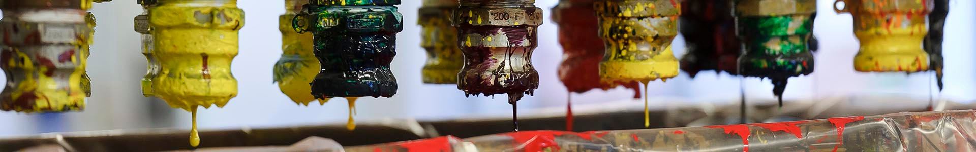 Paint nozzles marked with colored paint are seen at the Akzo Nobel NV paint production facility in Sassenheim, Netherlands