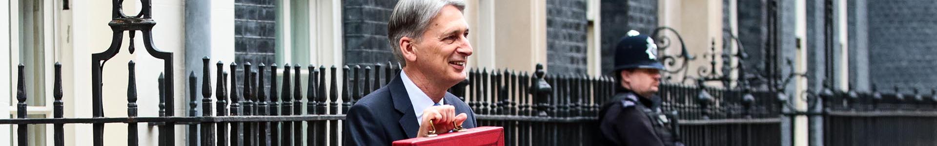 LONDON, ENGLAND - NOVEMBER 22: Britain's Chancellor of the Exchequer Philip Hammond holds the red case as he departs 11 Downing Street to deliver his budget to Parliament on November 22, 2017 in London, England. Later today Chancellor of the Exchequer Philip Hammond will deliver his 2017 budget to Parliament. The conservative government is continuing with its aim of reducing the deficit and balancing the books as the UK negotiates its departure from the European Union. (Photo by Jack Taylor/Getty Images)