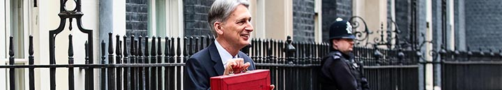 LONDON, ENGLAND - NOVEMBER 22: Britain's Chancellor of the Exchequer Philip Hammond holds the red case as he departs 11 Downing Street to deliver his budget to Parliament on November 22, 2017 in London, England. Later today Chancellor of the Exchequer Philip Hammond will deliver his 2017 budget to Parliament. The conservative government is continuing with its aim of reducing the deficit and balancing the books as the UK negotiates its departure from the European Union. (Photo by Jack Taylor/Getty Images)